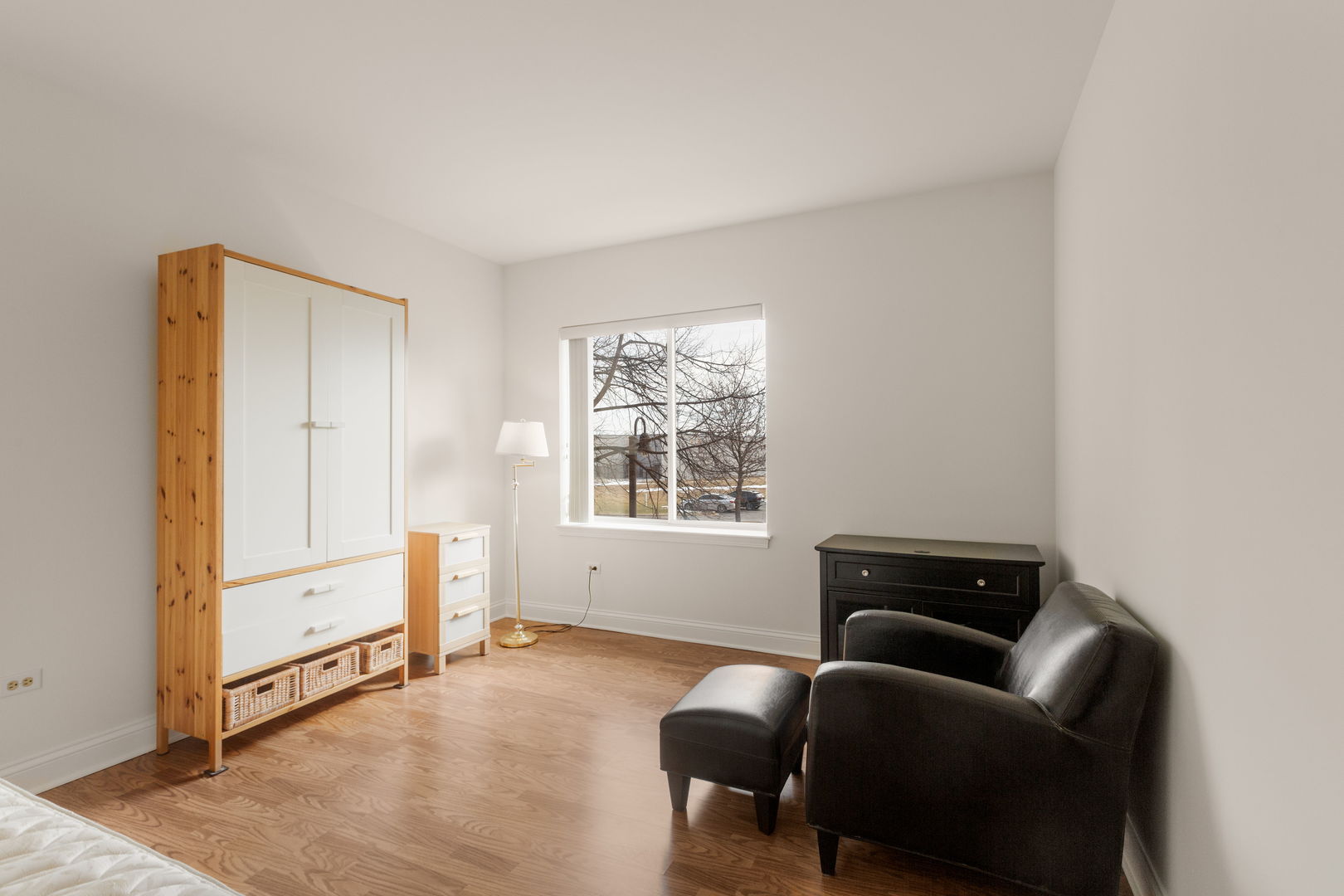 125 North Buffalo Grove Road, Unit 104 Buffalo Grove, IL 60089 - Photo 8 of 17 a living room with furniture and a window