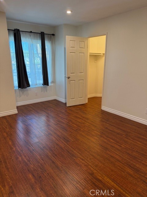 2500 East 4th Street, Unit 203 Long Beach, CA 90814 - Photo 21 of 35 an empty room with wooden floor and windows
