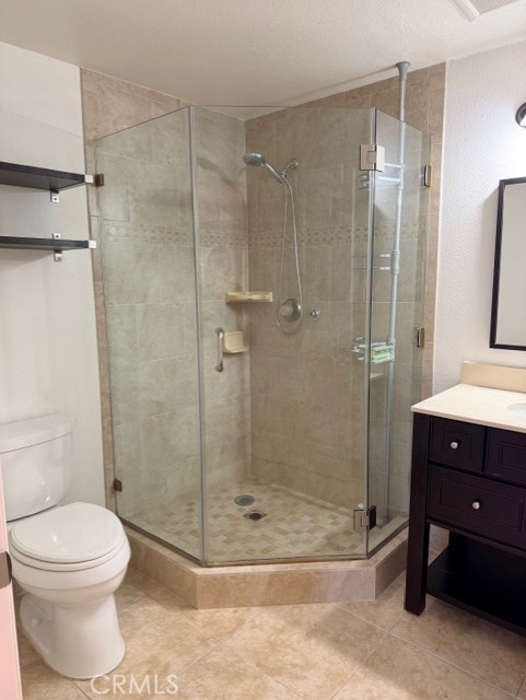 2500 East 4th Street, Unit 203 Long Beach, CA 90814 - Photo 25 of 35 a bathroom with a shower a toilet and sink