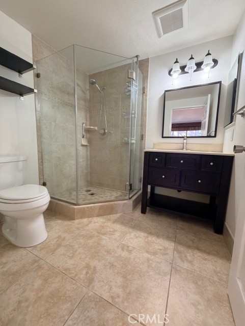 2500 East 4th Street, Unit 203 Long Beach, CA 90814 - Photo 26 of 35 a bathroom with a toilet a sink and shower