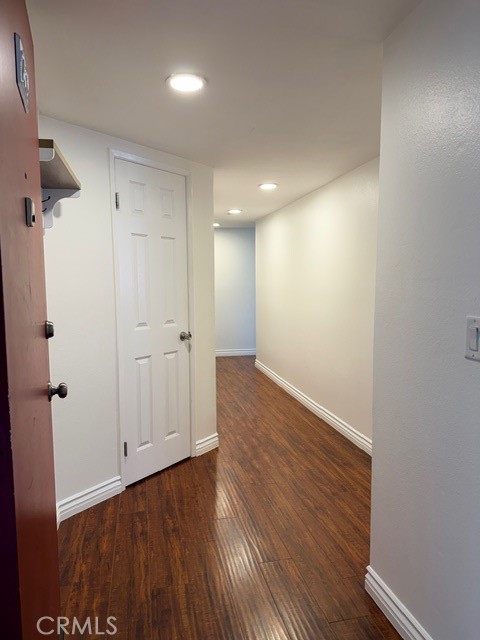 2500 East 4th Street, Unit 203 Long Beach, CA 90814 - Photo 5 of 35 wooden floor in an empty room with a window