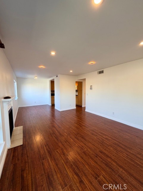 2500 East 4th Street, Unit 203 Long Beach, CA 90814 - Photo 8 of 35 a view of a big room with wooden floor and windows