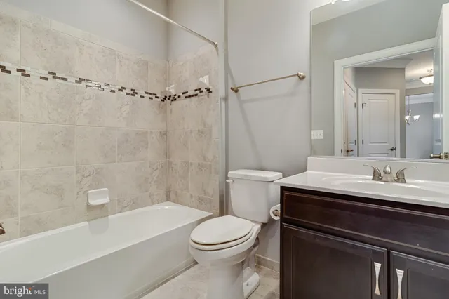 a bathroom with a sink a toilet and a bathtub