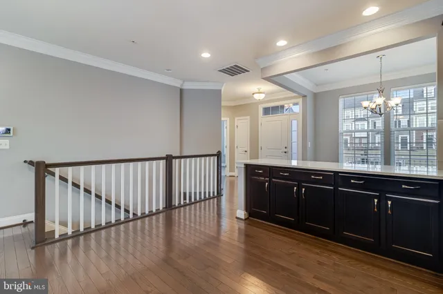 a open kitchen with wooden floor