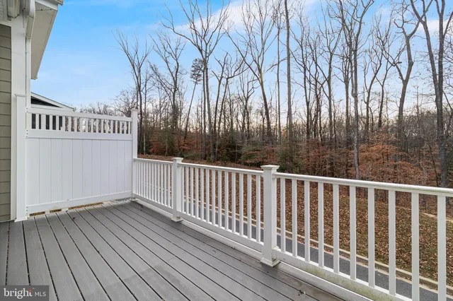 a view of balcony with wooden floor