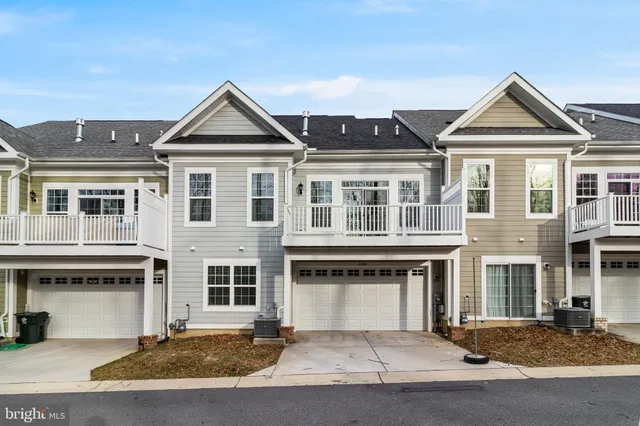 a front view of a building with a yard