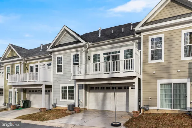 a front view of a house with a garage