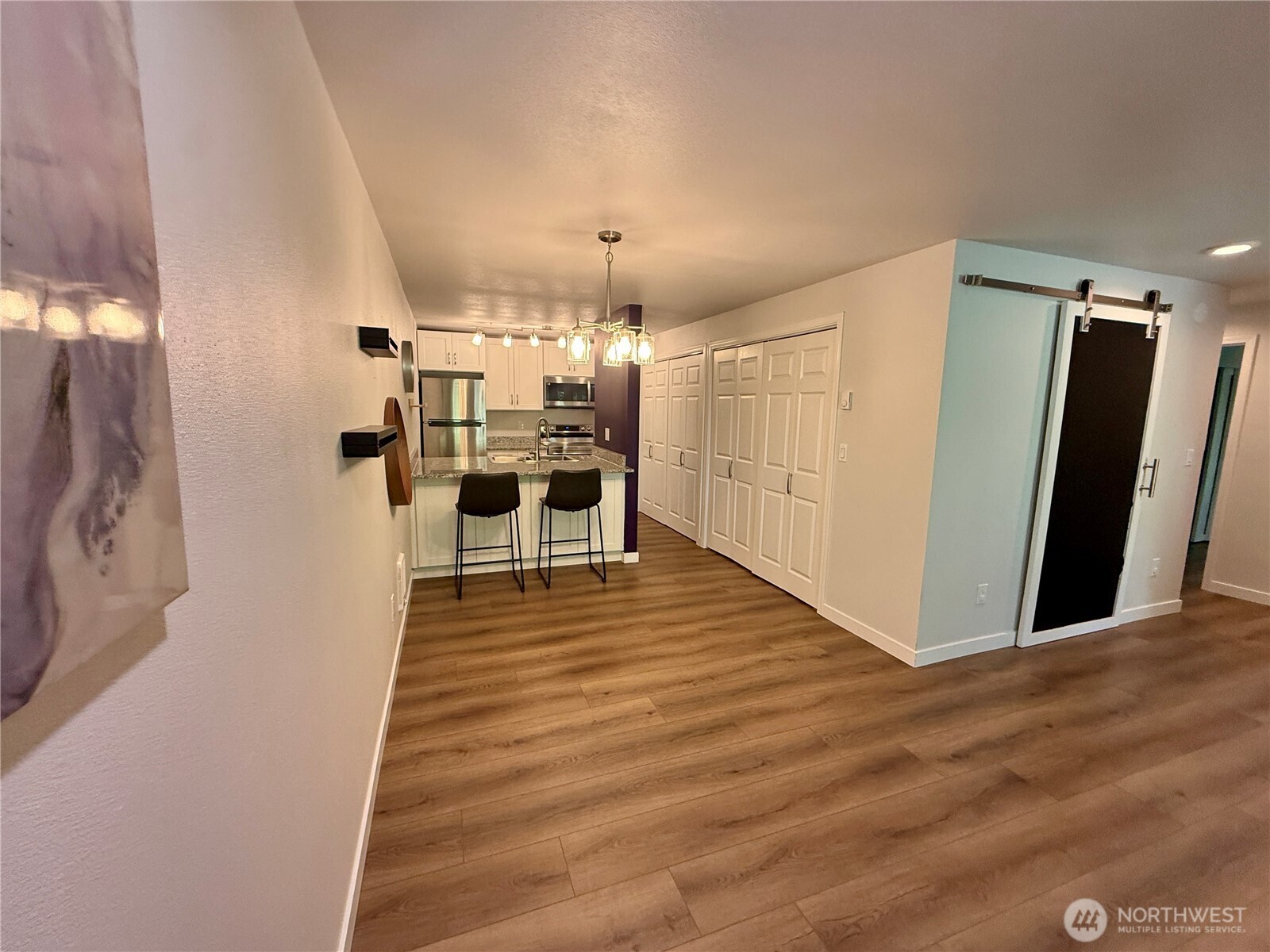 526 South 323rd Place, Unit 11F Federal Way, WA 98003 - Photo 11 of 24 a view of a living room with wooden floor