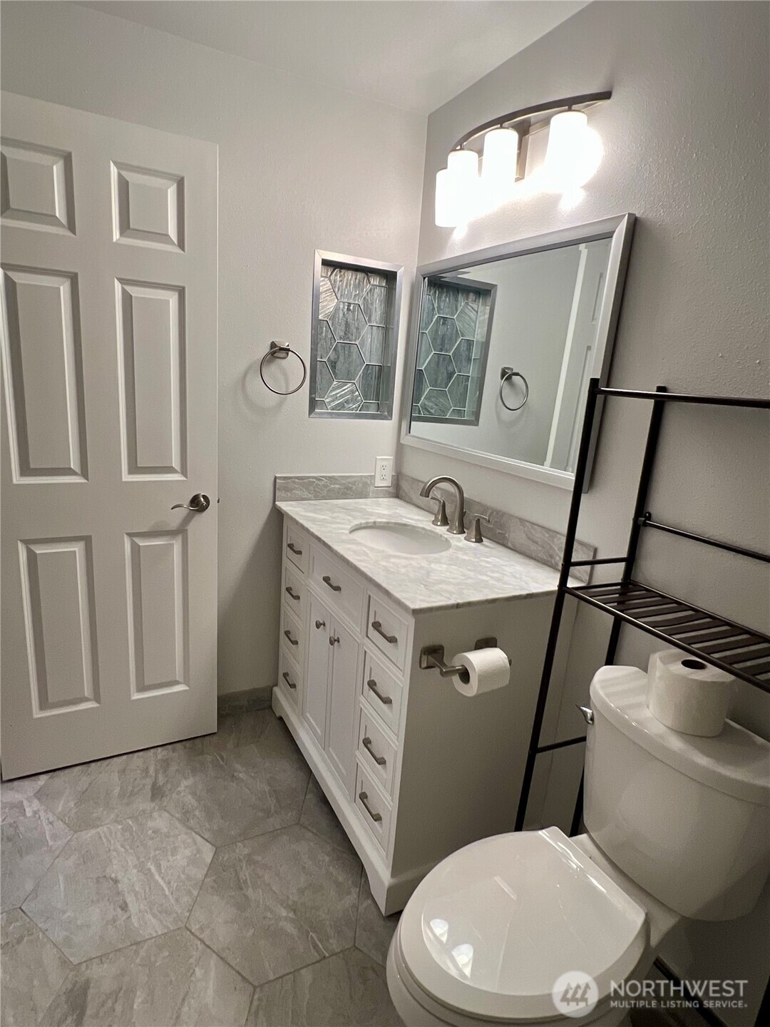 526 South 323rd Place, Unit 11F Federal Way, WA 98003 - Photo 16 of 24 a bathroom with a sink toilet vanity and window