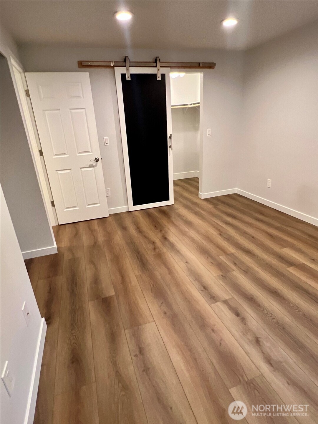 526 South 323rd Place, Unit 11F Federal Way, WA 98003 - Photo 20 of 24 a view of a closet area with wooden floor