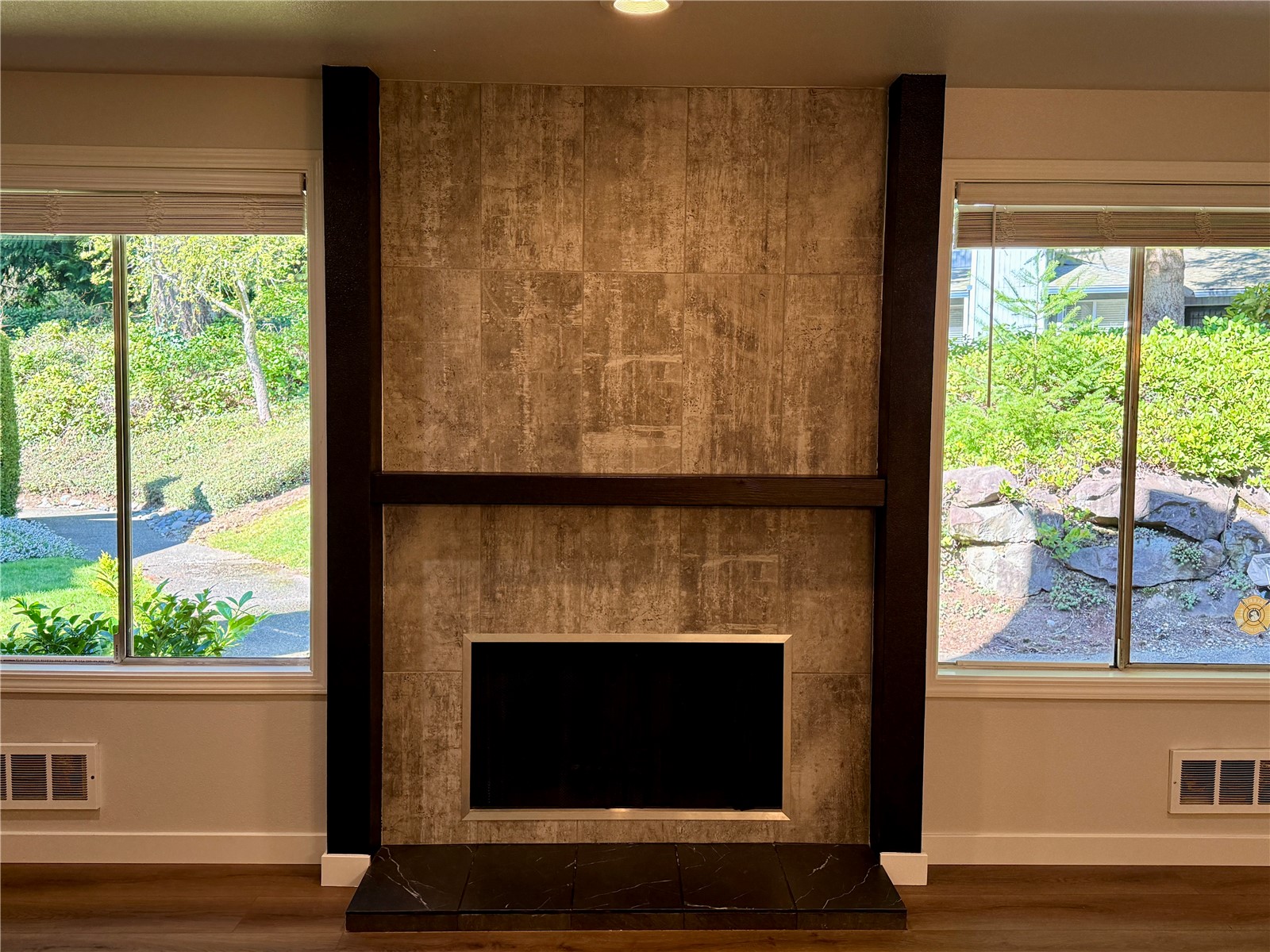 526 South 323rd Place, Unit 11F Federal Way, WA 98003 - Photo 7 of 24 a living room with a fireplace and a floor to ceiling window
