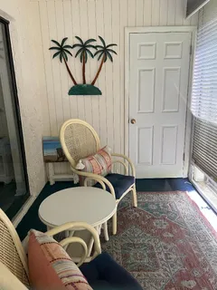 a kitchen with refrigerator and window