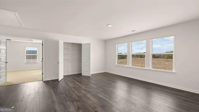 an aerial view of a house with a lake view