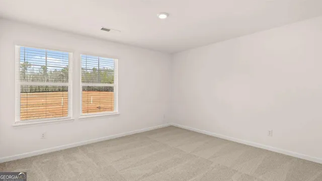 a view of a swimming pool with a patio and a yard