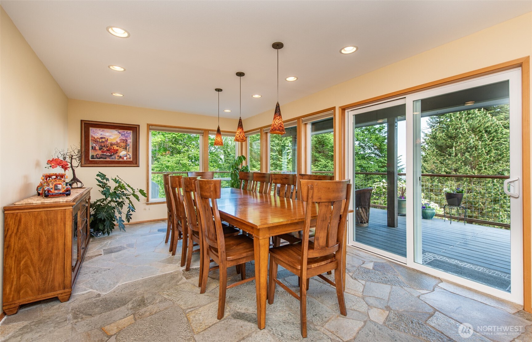 322 Ravens Ridge Road Sequim, WA 98382 - Photo 13 of 40 a dining room with stainless steel appliances granite countertop furniture and a floor to ceiling window