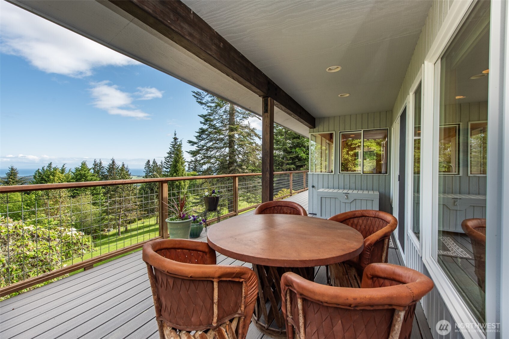 322 Ravens Ridge Road Sequim, WA 98382 - Photo 14 of 40 a view of a balcony with chair and glass door