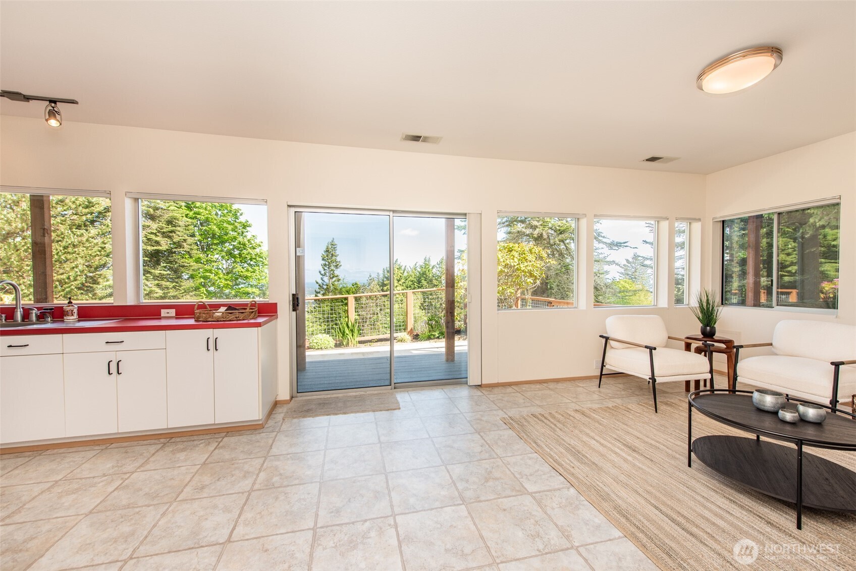322 Ravens Ridge Road Sequim, WA 98382 - Photo 27 of 40 a living room with furniture and large windows