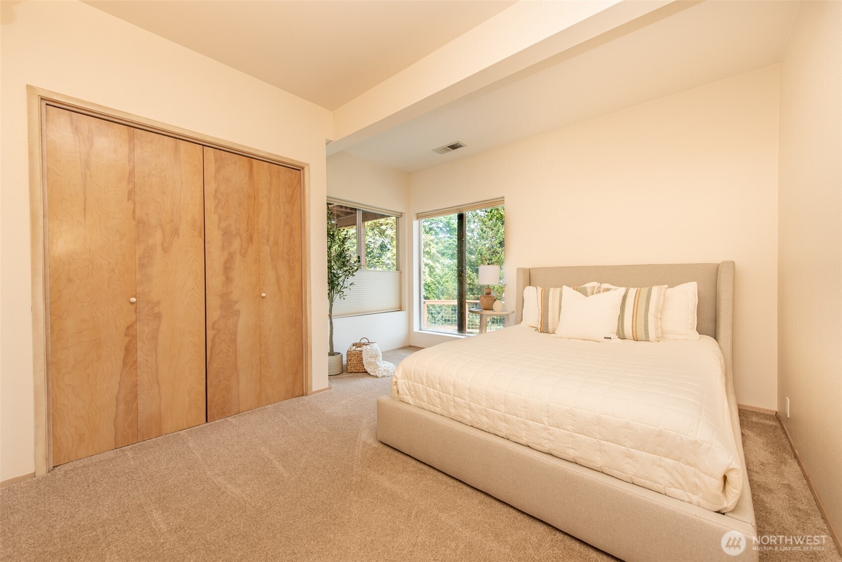 322 Ravens Ridge Road Sequim, WA 98382 - Photo 31 of 40 a bedroom with a large bed and a window