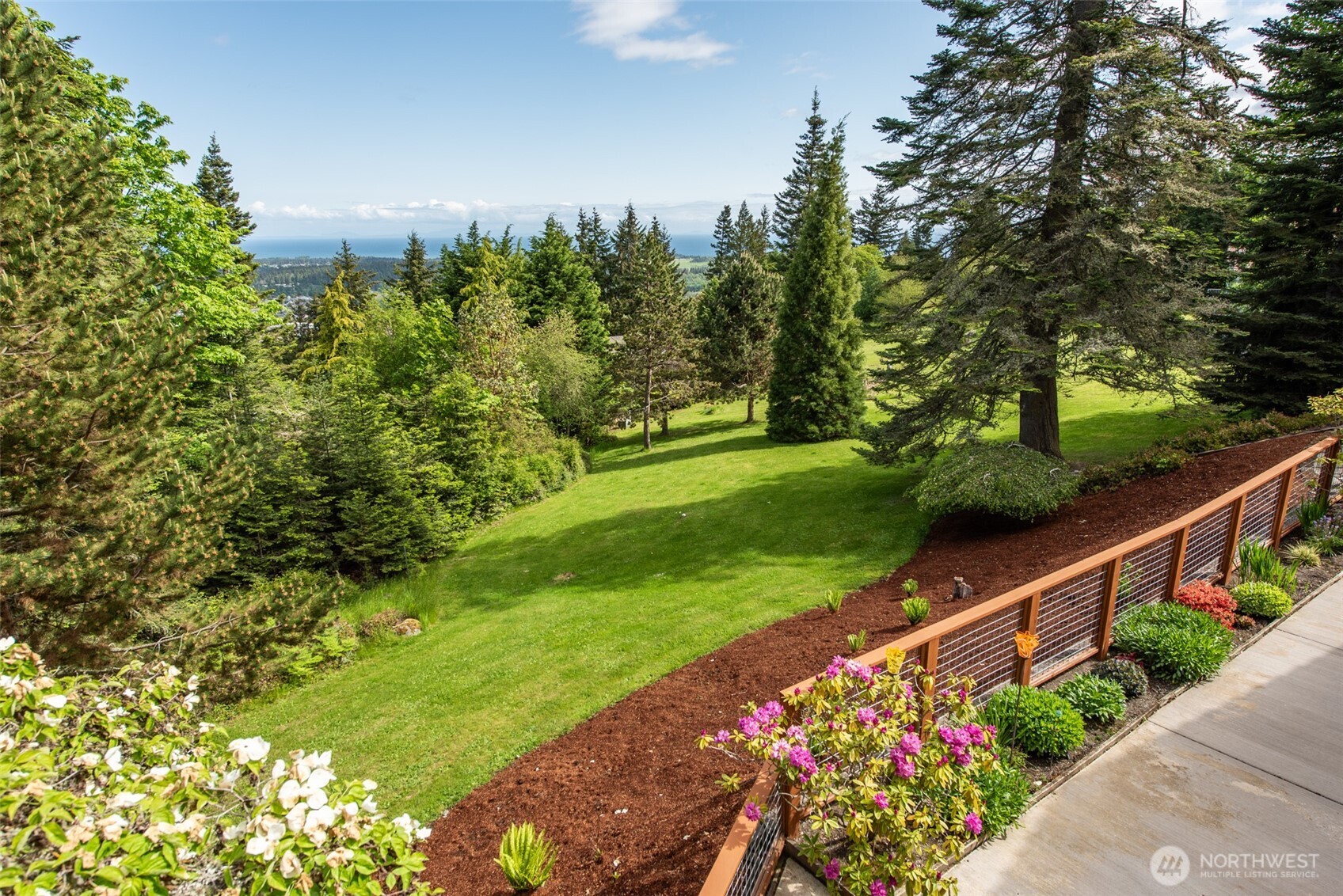 322 Ravens Ridge Road Sequim, WA 98382 - Photo 34 of 40 a view of a garden with flower in it