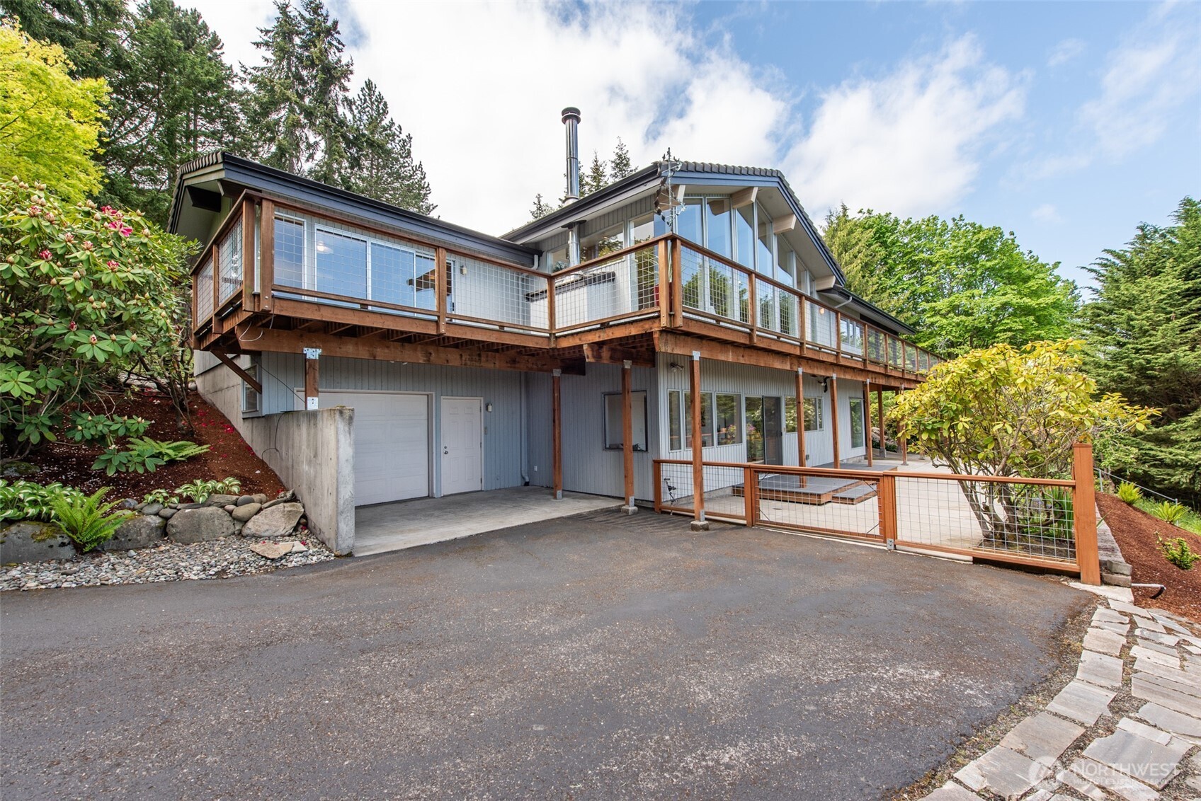 322 Ravens Ridge Road Sequim, WA 98382 - Photo 36 of 40 a view of a house with a yard and sitting area