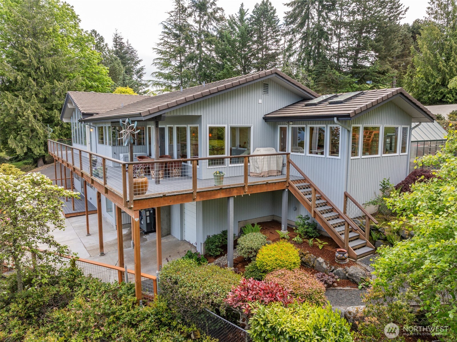 322 Ravens Ridge Road Sequim, WA 98382 - Photo 38 of 40 a aerial view of a house with a yard and potted plants
