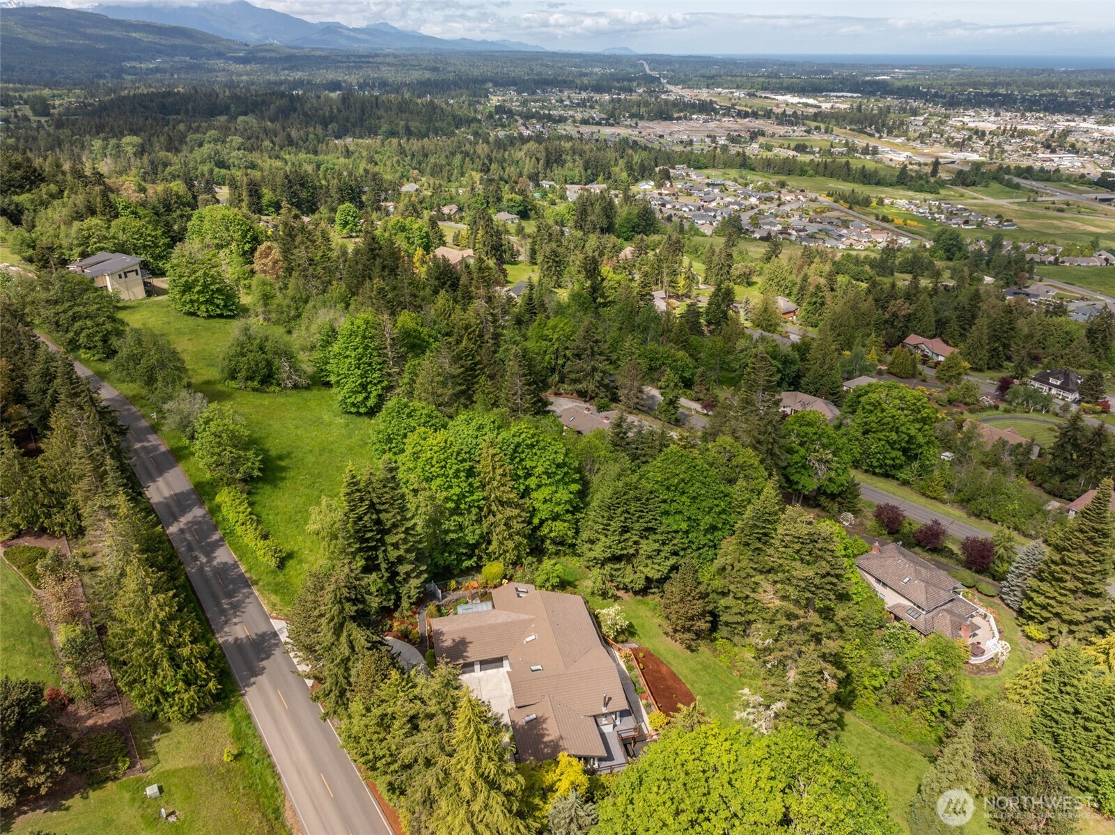 322 Ravens Ridge Road Sequim, WA 98382 - Photo 39 of 40 an aerial view of a houses with a yard