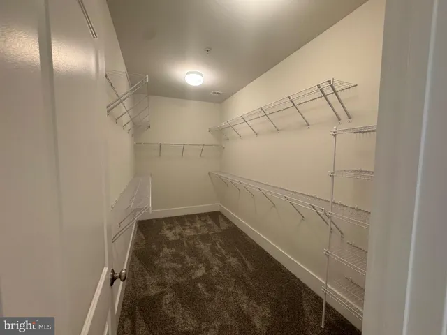 a view of a room with racks on the wall