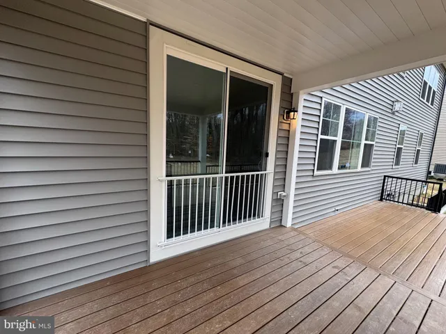 a view of a house with a yard and stairs