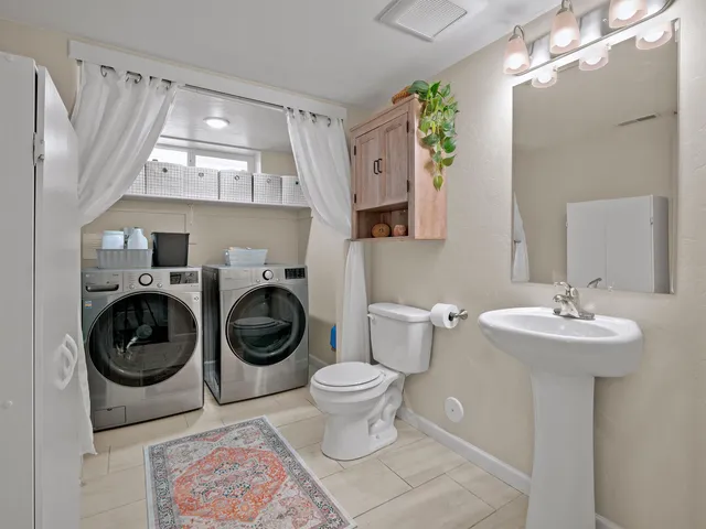 a bathroom with a sink and toilet