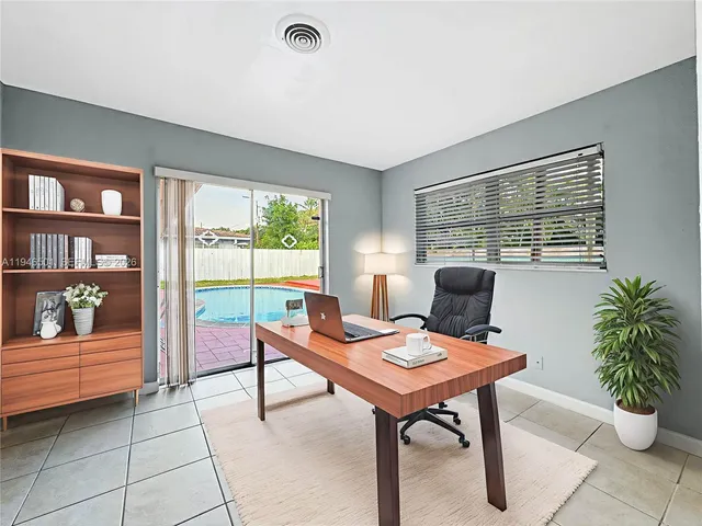a reading room with furniture and window