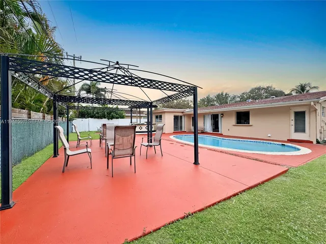 a view of a patio with swimming pool