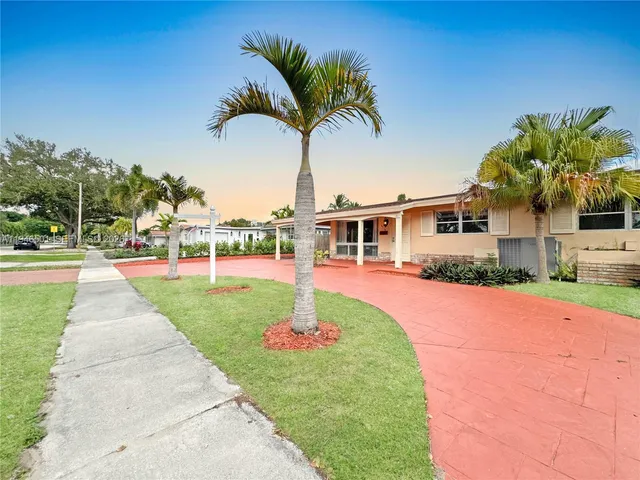 a house with palm tree in front of it