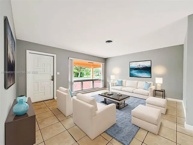 a living room with furniture and a window