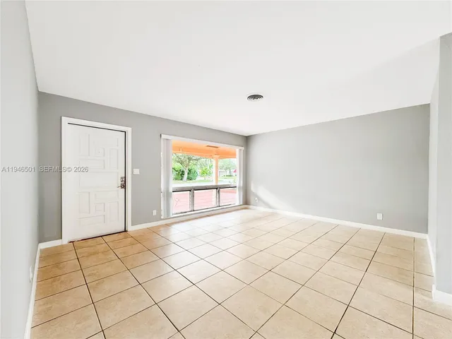 a view of an empty room and window