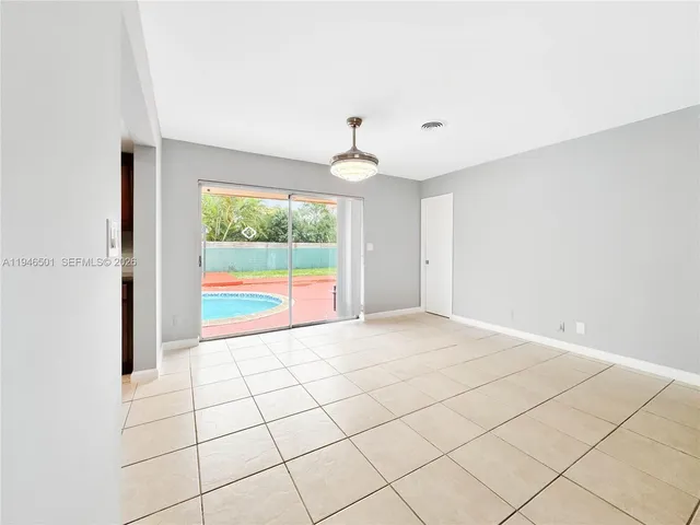 a view of an empty room and window