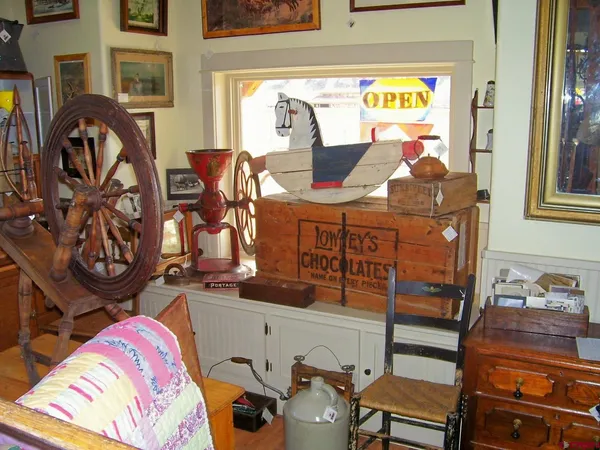a view of a livingroom with furniture and windows