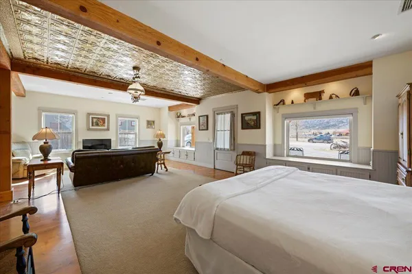 a bed room with furniture and window