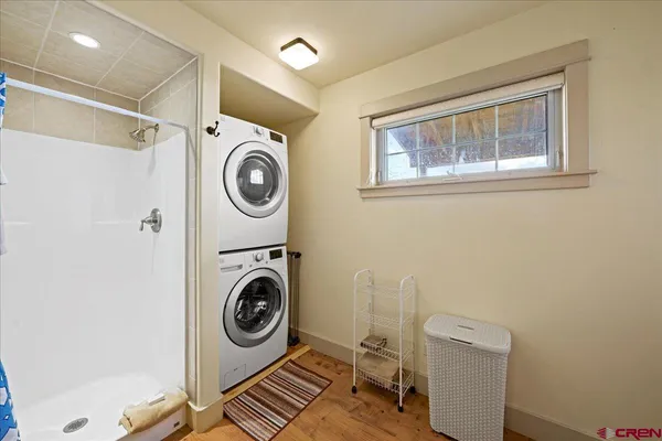 a utility room with sink dryer and washer