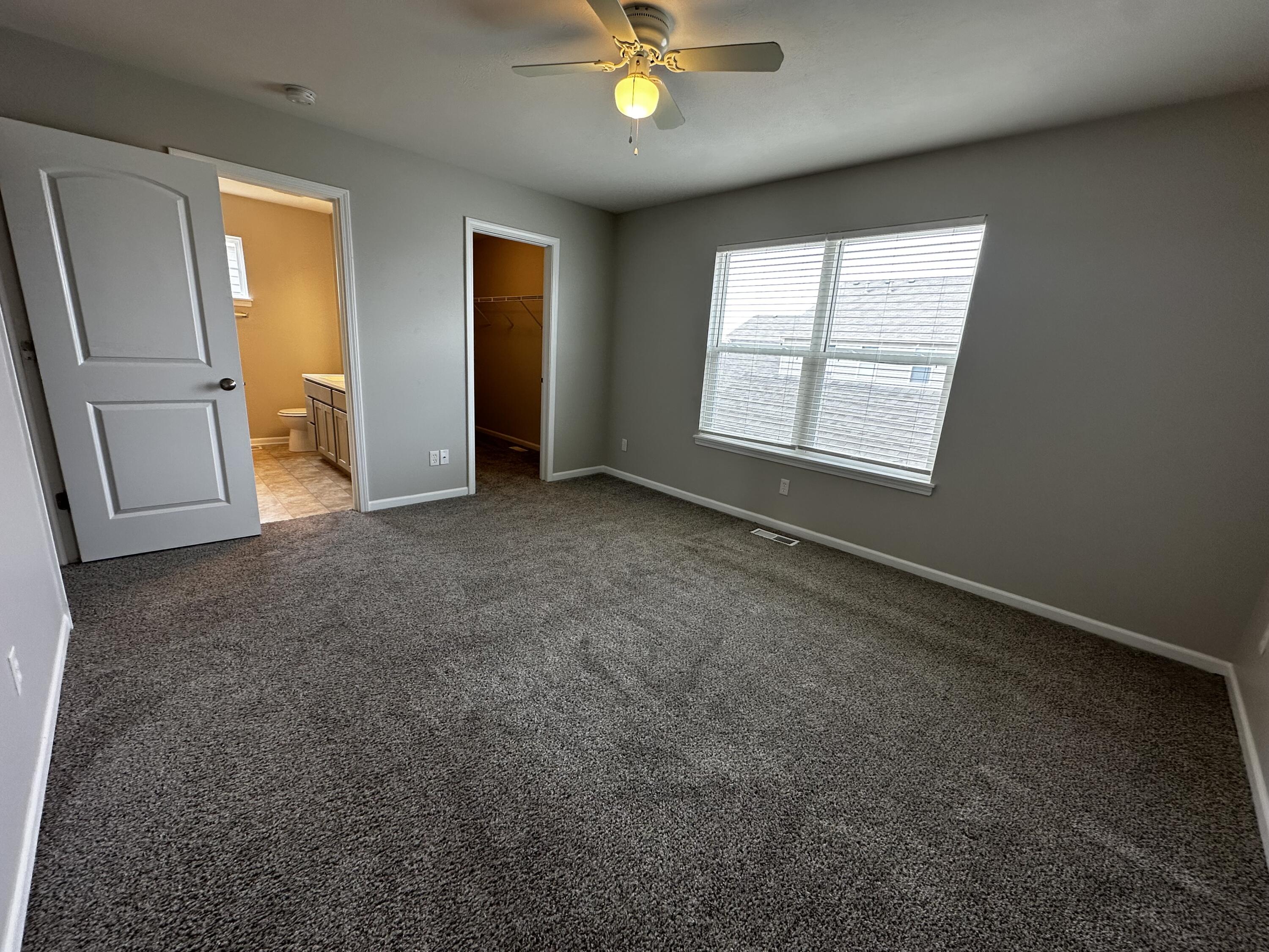 1077 East 115th Lane Crown Point, IN 46307 - Photo 11 of 16 a view of an empty room with a window