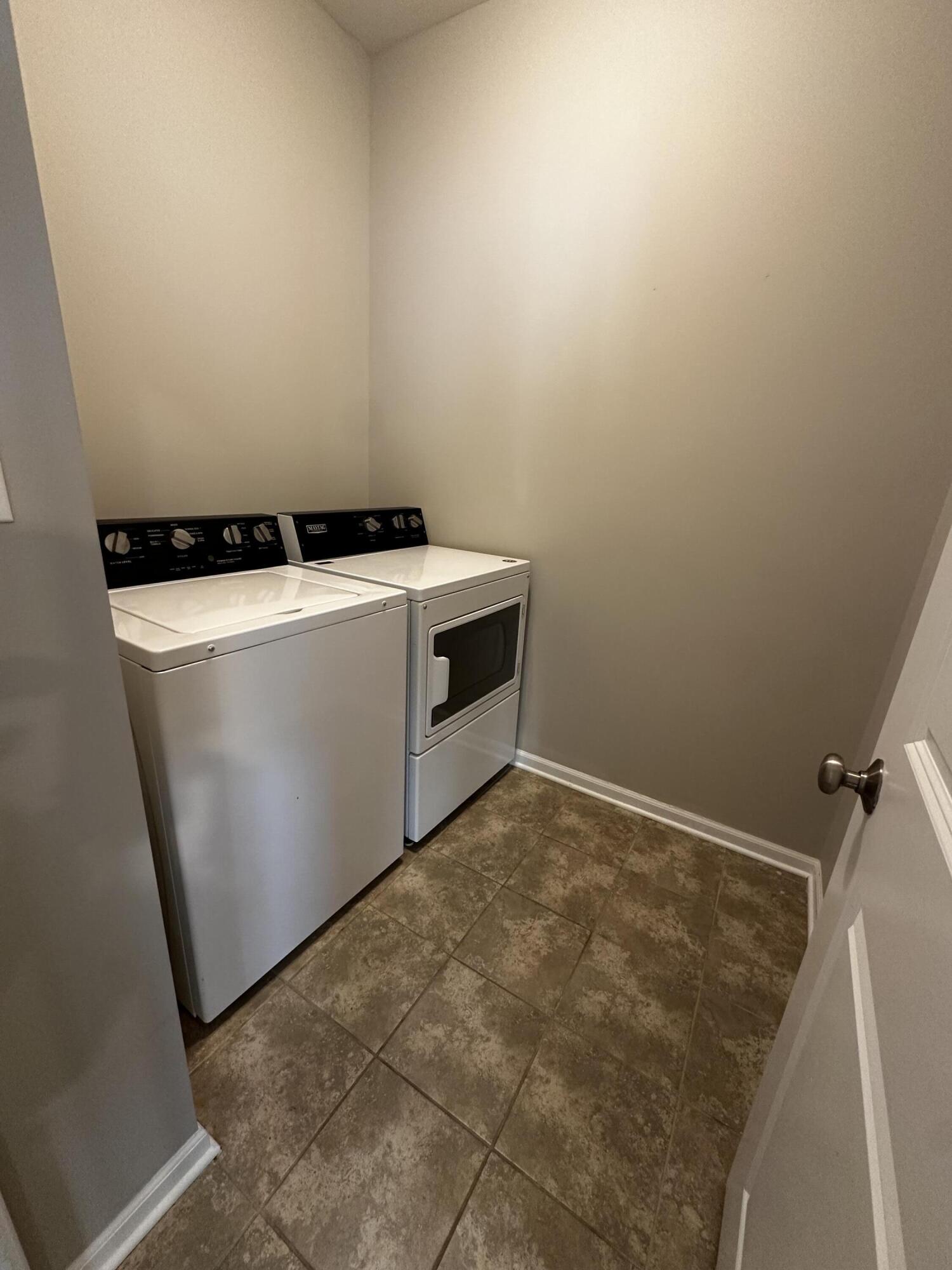 1077 East 115th Lane Crown Point, IN 46307 - Photo 10 of 16 a view of storage and utility room with washer and dryer