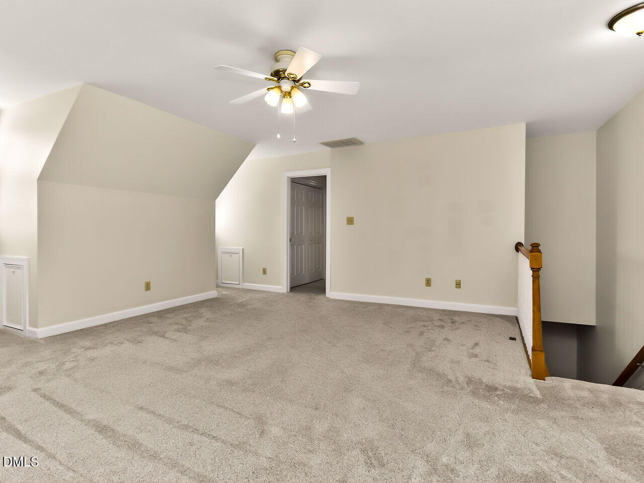 6104 Wolverhampton Drive Raleigh, NC 27603 - Photo 22 of 35 a view of an empty room with chandelier fan