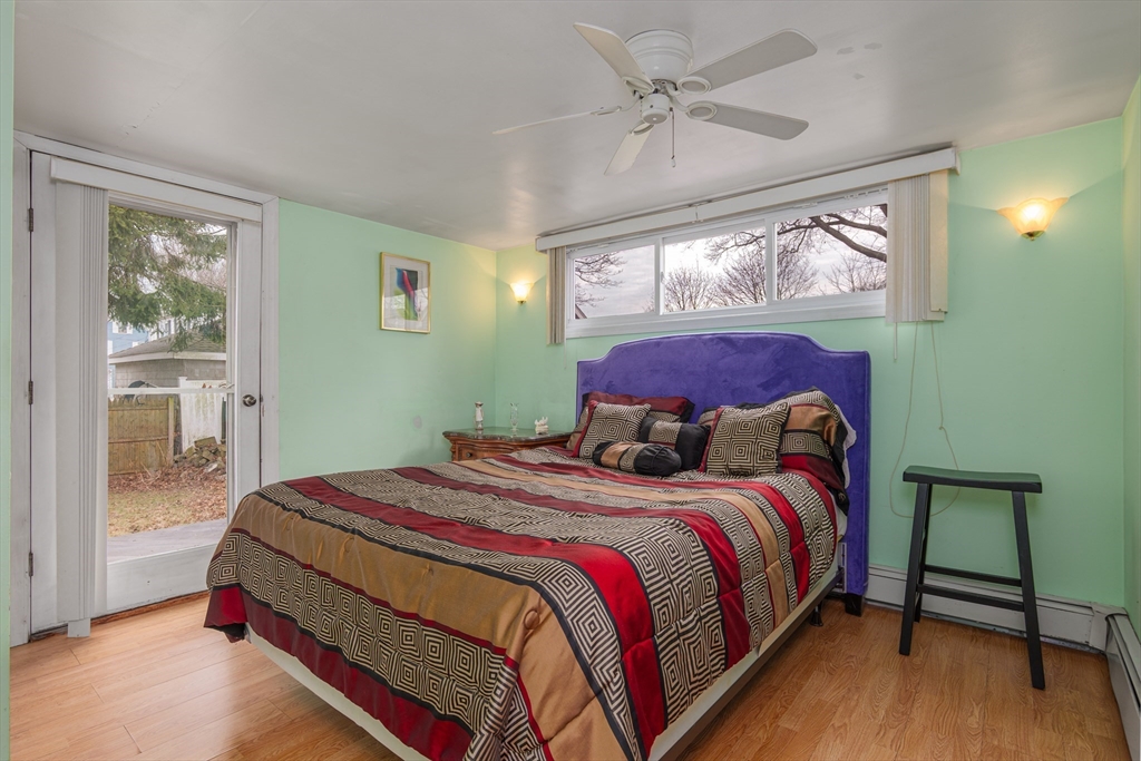 6 Hayes Avenue Beverly, MA 01915 - Photo 15 of 24 a bedroom with a large bed and a window