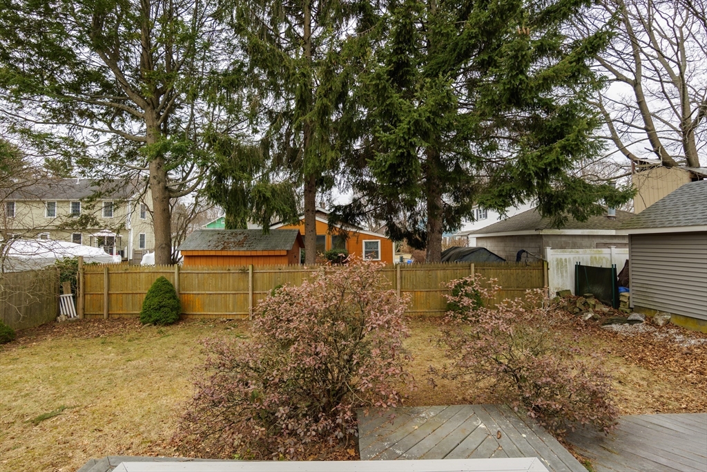 6 Hayes Avenue Beverly, MA 01915 - Photo 19 of 24 a front view of a house with a yard