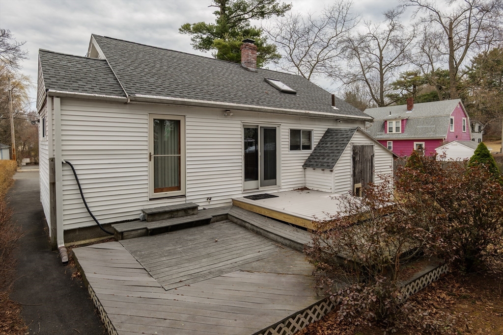 6 Hayes Avenue Beverly, MA 01915 - Photo 21 of 24 a front view of a house with a yard