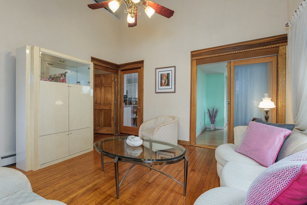 6 Hayes Avenue Beverly, MA 01915 - Photo 8 of 24 a living room with furniture and a chandelier