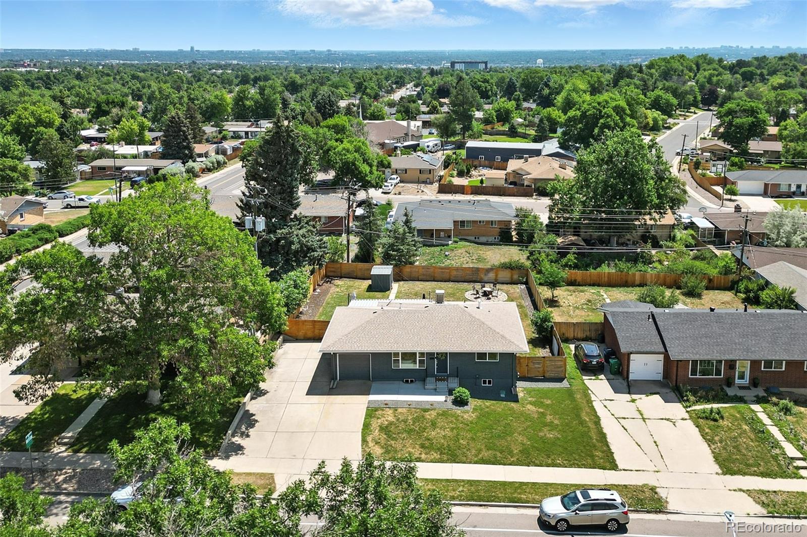 2714 South Raleigh Street Denver, CO 80236 - Photo 33 of 34 an aerial view of a house with a yard