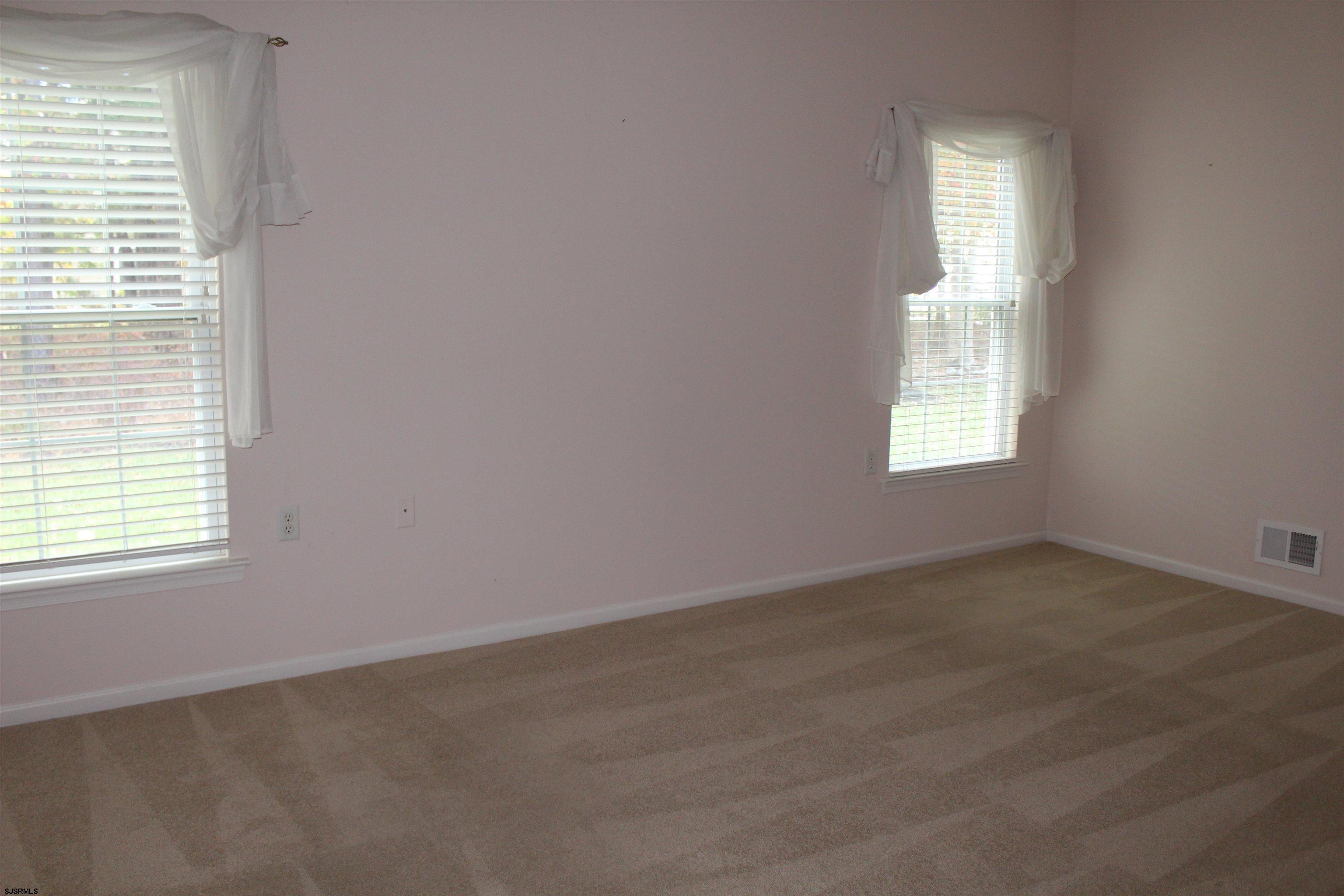 39 Poppy Road Egg Harbor Township, NJ 08234 - Photo 15 of 37 an empty room with windows