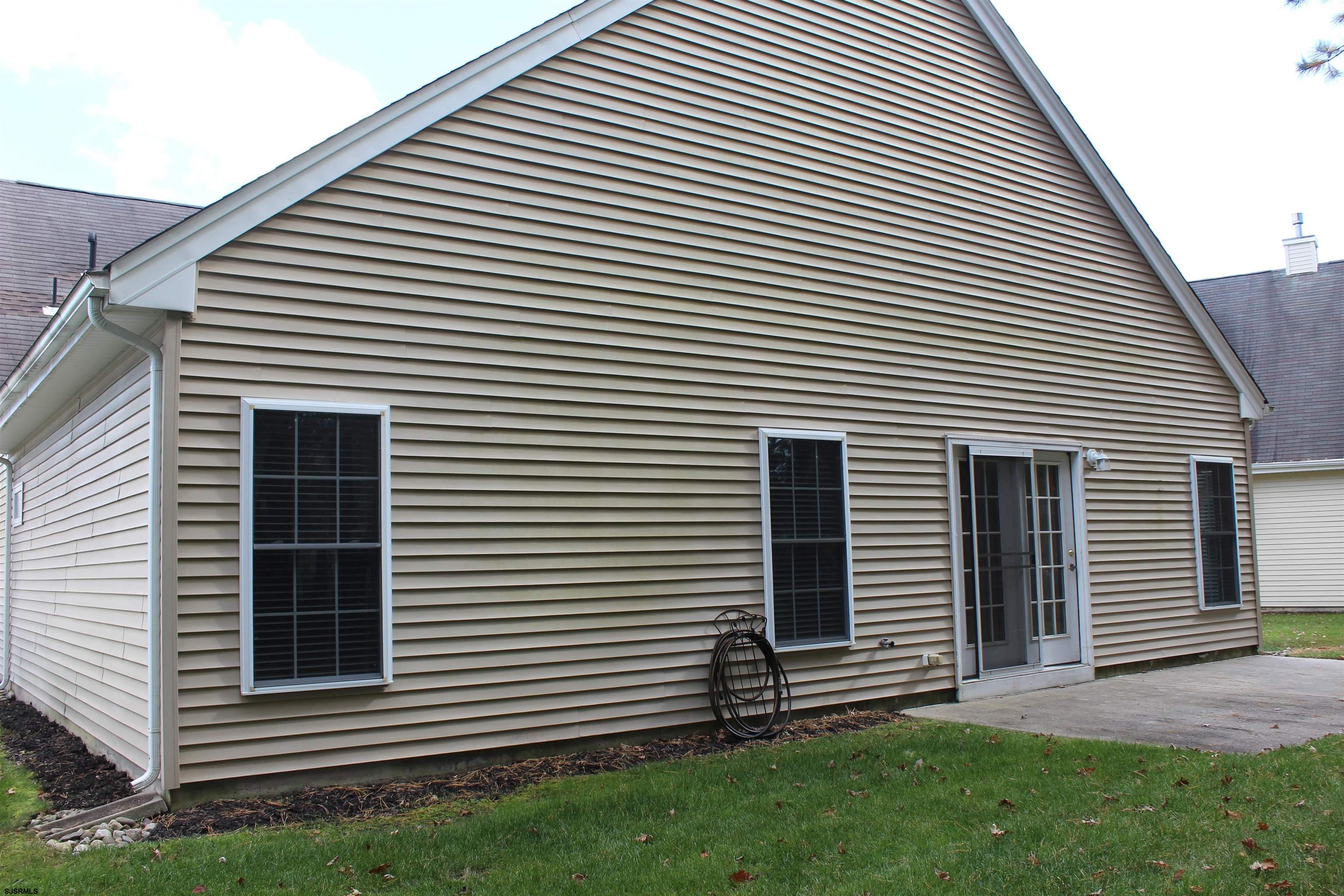 39 Poppy Road Egg Harbor Township, NJ 08234 - Photo 29 of 37 a front view of a house with a yard