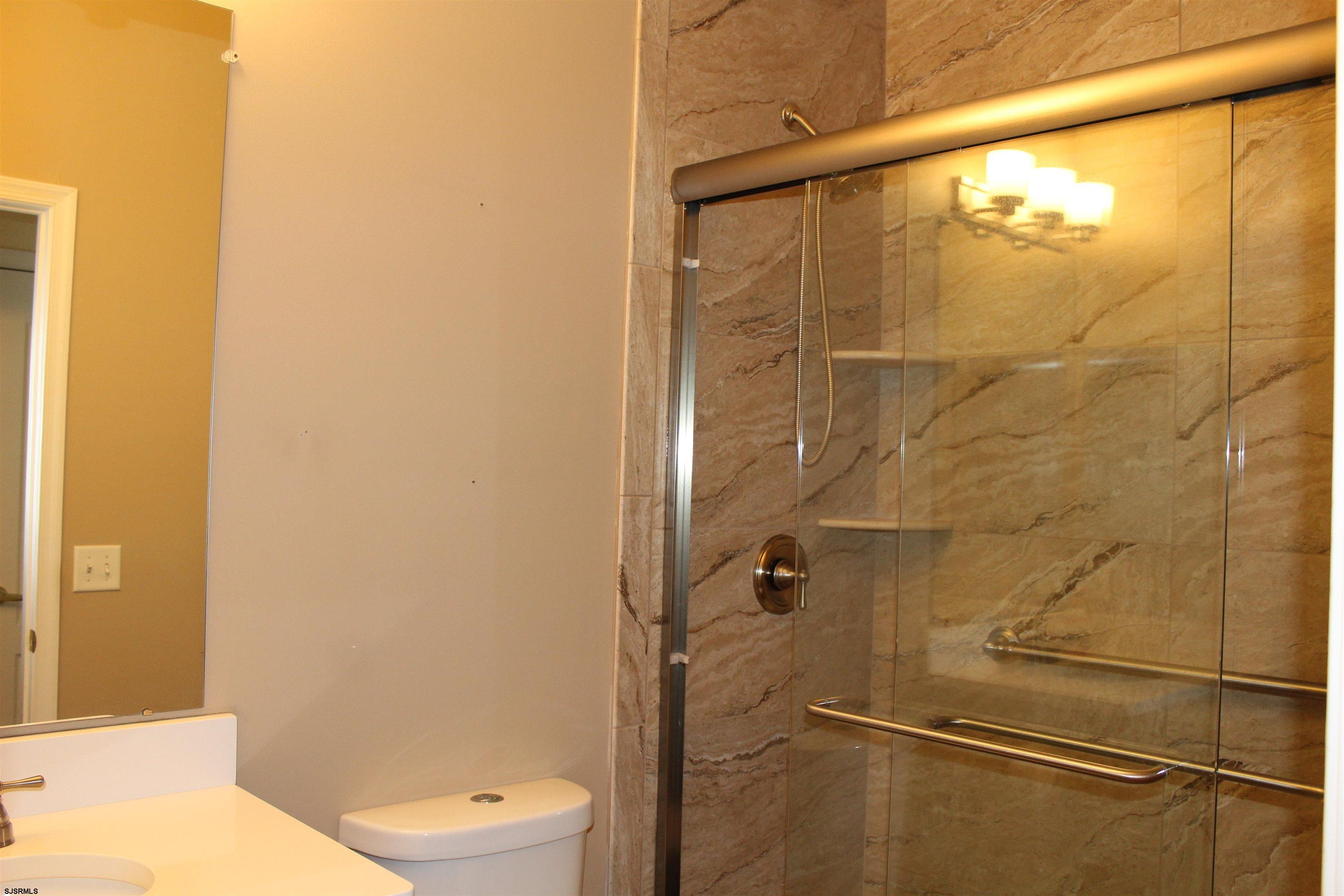 39 Poppy Road Egg Harbor Township, NJ 08234 - Photo 8 of 37 a bathroom with a toilet and a shower