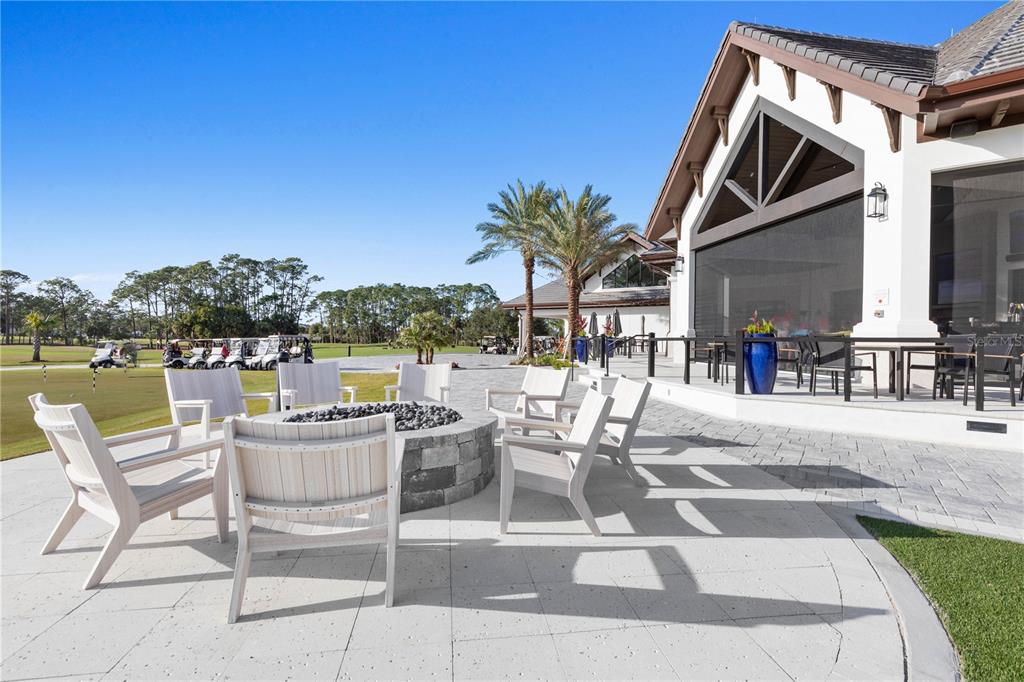 426 Long Cove Road Ormond Beach, FL 32174 - Photo 58 of 73 a view of a patio with a table and chairs